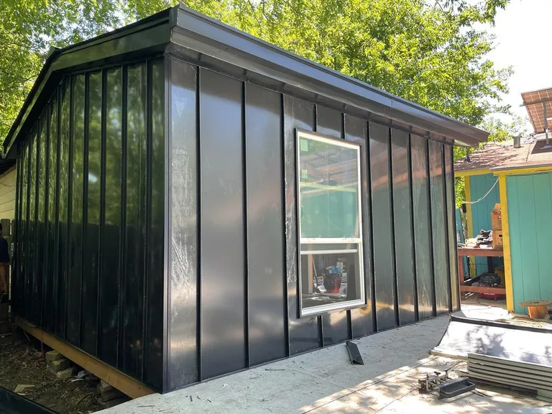 Black standing seam metal wall panels for Roof Inspection in Upper Chichester
